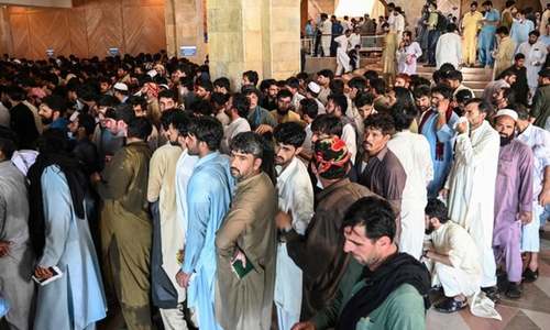 Desperate overseas workers overrun Covid-19 vaccine centre in Islamabad