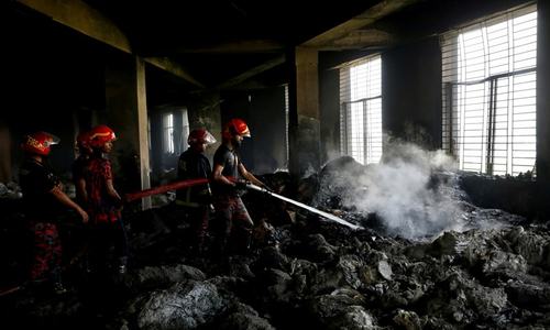 Bangladesh factory owner held after fire kills 52