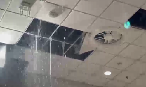 Rainwater pours down at Islamabad airport as false ceilings collapse