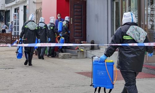 Chinese cities test millions as virus cases surge