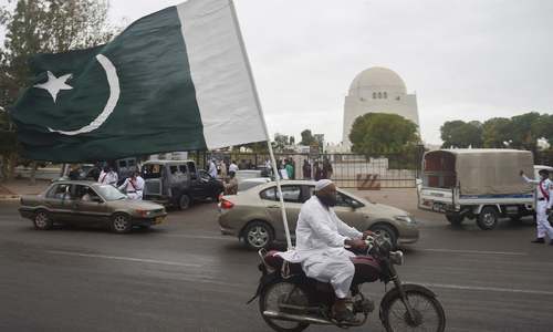 In pictures: Decked out in green and white, Pakistanis celebrate second Independence Day under Covid's shadow
