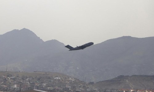 Celebratory gunfire rings out across Kabul as last US troops leave Afghanistan after 20 years