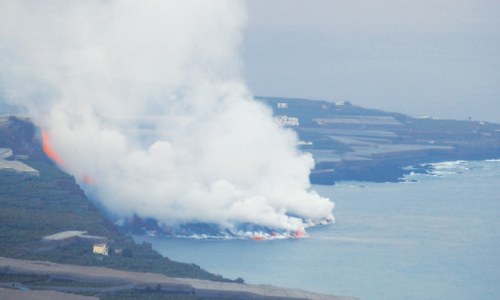 Canaries volcano lava reaches sea, raises toxic gas fears