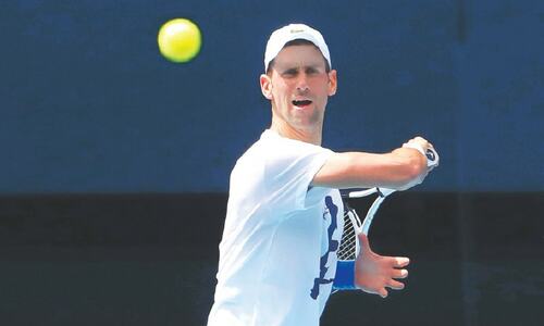 Djokovic back into swing but Australia deportation threat still looms