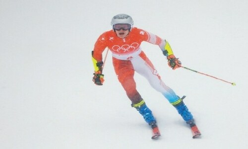 Skiers struggle as real snow falls on Winter Olympics