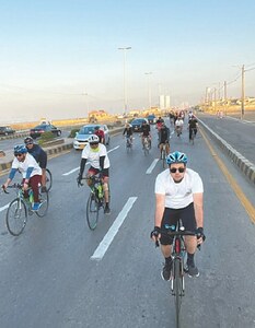 Cycling enthusiasts pedal to promote education