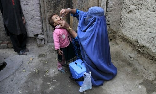 Afghan group rejects charge it murdered polio workers Afghan group rejects charge it murdered polio workers