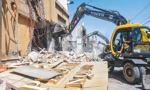 Drive to demolish illegally constructed wedding halls on Korangi Road begins