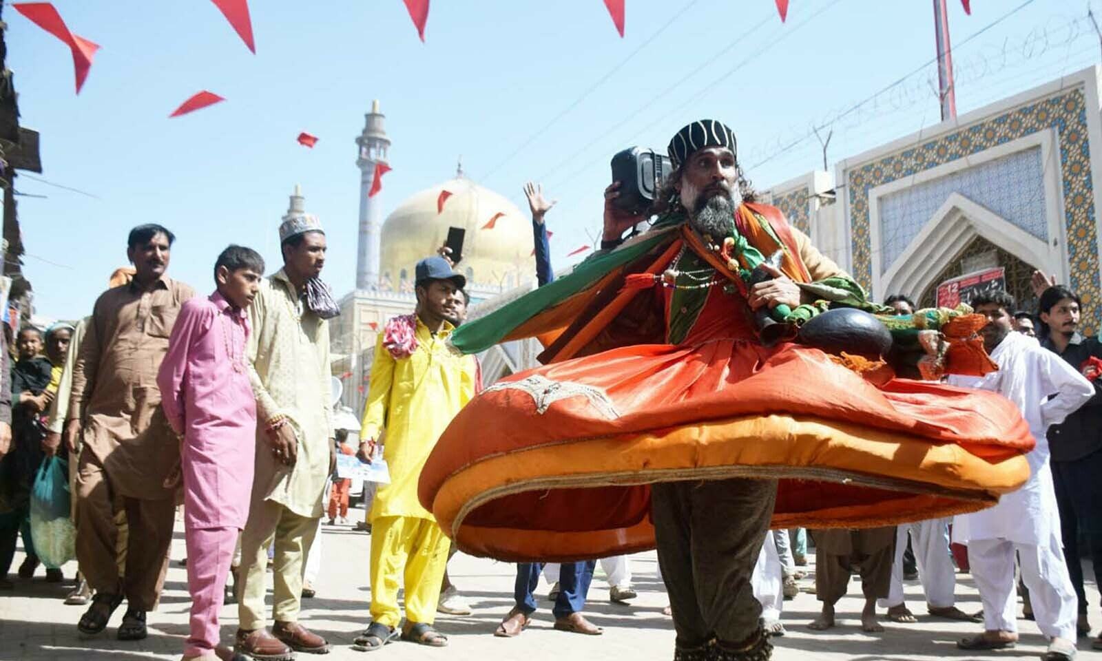 In pictures: Without spectre of Covid-19, full-scale celebrations resume at Lal Shahbaz Qalandar's urs In pictures: Without spectre of Covid-19, full-scale celebrations resume at Lal Shahbaz Qalandar's urs