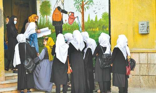 Leaving girls in tears, Taliban order closure of high schools