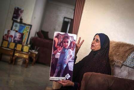 Mother of Palestinian Riad Eshkountana speaks during an interview at a their residence in Gaza City, on April 27, 2022. —Mahmud Hams/AFP.