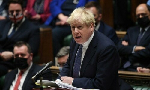British PM Boris Johnson digs in as ministers, lawmakers desert govt
