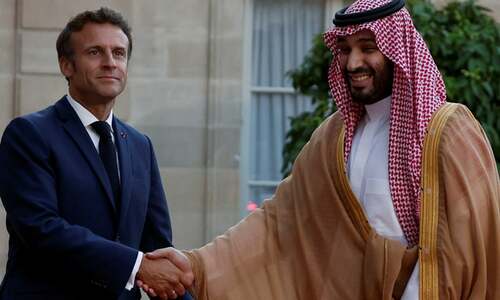 Macron defies anger to welcome MBS