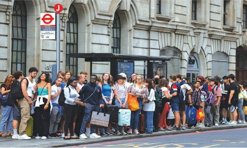 Strikes cripple London transport as UK slips into recession