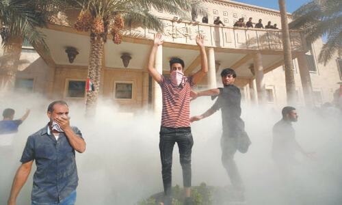 12 killed in Baghdad clashes as Moqtada Sadr loyalists storm complex 12 killed in Baghdad clashes as Moqtada Sadr loyalists storm complex