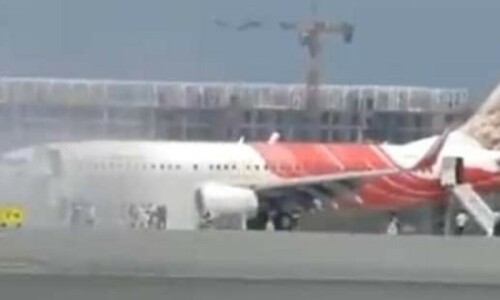 Air India Express plane evacuated after engine fire in Oman: officials Air India Express plane evacuated after engine fire in Oman: officials