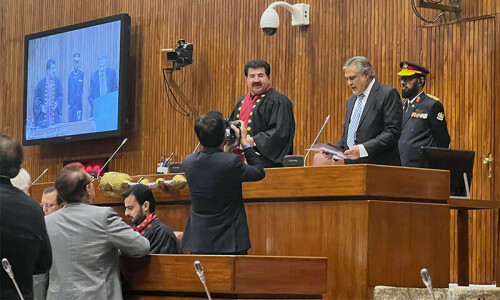 Ishaq Dar sworn in as senator amid opposition protest Ishaq Dar sworn in as senator amid opposition protest