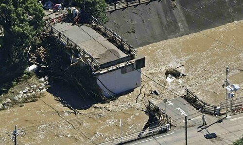 Two killed as typhoon lashes central Japan Two killed as typhoon lashes central Japan