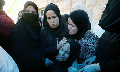 Palestinian boy buried; US seeks probe into death
