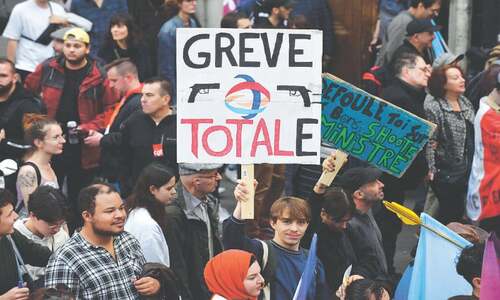Thousands of protesters march in Paris to vent anger over inflation