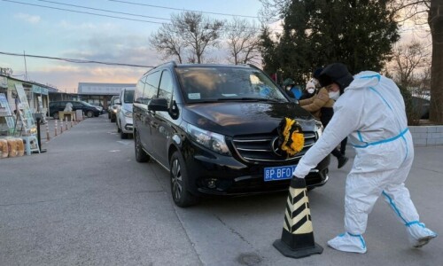 Hearses queue at Beijing crematorium, even as China reports no new Covid deaths