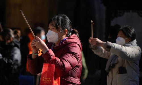 Shanghai asks residents to stay in on Christmas as Covid surges