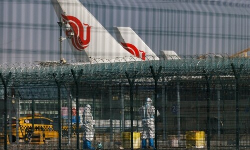 Travel curbs rack up as Covid-hit China readies reopening