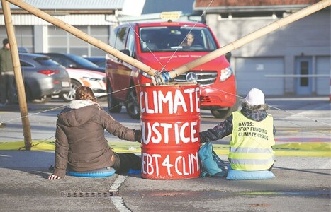 Climate activists target big oil firms in Davos protests