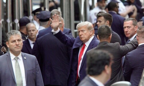 Donald Trump turns himself in to face historic criminal charges in hush money case Donald Trump turns himself in to face historic criminal charges in hush money case