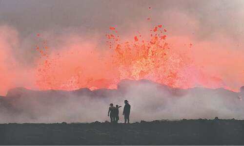 &lsquo;Orange like the sun&rsquo;: visitors  flock to Iceland volcano