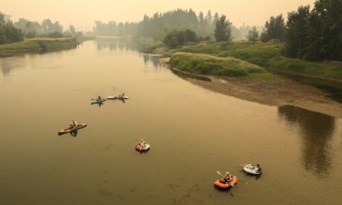 Tens of thousands flee western Canada wildfires