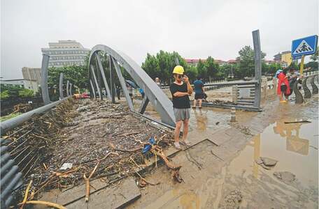 Beijing on alert as heavy rain batters northern China