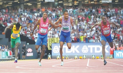 Lyles new 100m king, Cheptegei clinches 10,000m gold