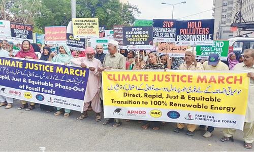 Climate activists stage rally in Karachi to demand end to fossil fuels