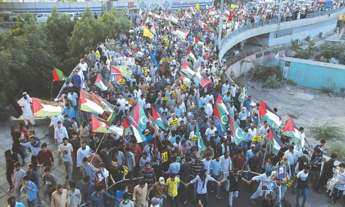 Protest march, candlelit vigil held for Palestinians in Karachi