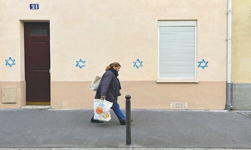 France probes graffiti of anti-Semitic symbols in Paris