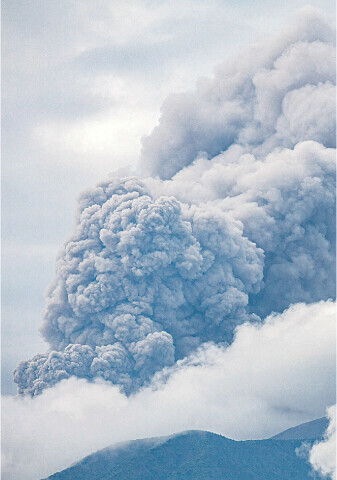 Hikers evacuated as Indonesian volcano spews ash tower