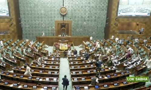 Man jumps into Indian parliament from visitors&rsquo; gallery, sets off smoke can
