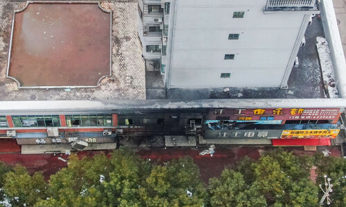 Shop fire kills 39 in China Shop fire kills 39 in China