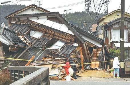 Japan quake toll rises to 73 as weather hampers rescuers