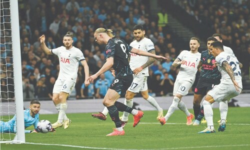 Haaland double puts City on brink of title