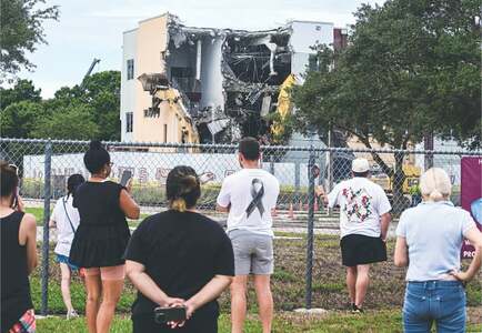Crews raze building that was scene of US school shooting