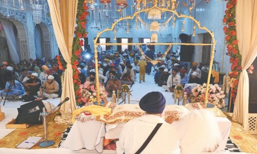Sikh pilgrims perform rituals at Dera Sahib