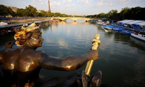 Suspense over triathlon as Seine fails water tests again Suspense over triathlon as Seine fails water tests again