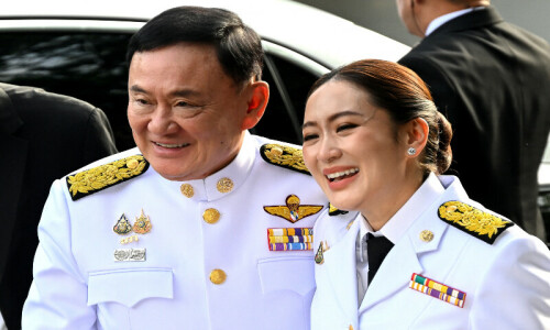 Thai king pardons Thaksin in birthday amnesty Thai king pardons Thaksin in birthday amnesty