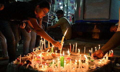 Indians demand justice in candlelight march for raped, murdered doctor