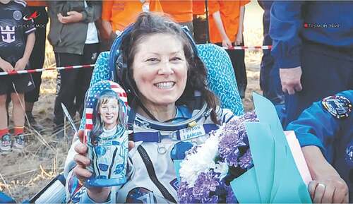 Russian cosmonauts return to Earth after record International Space Station stay Russian cosmonauts return to Earth after record International Space Station stay