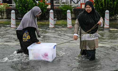More than 122,000 people evacuated in Malaysia after floods