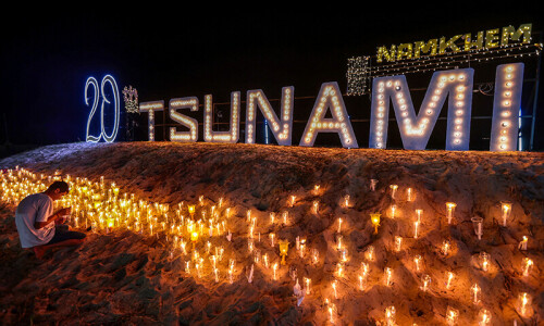 Tears, prayers as Asia mourns tsunami dead 20 years on Tears, prayers as Asia mourns tsunami dead 20 years on