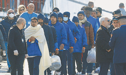 Migrants arrive in Albania from Italy under contested pact